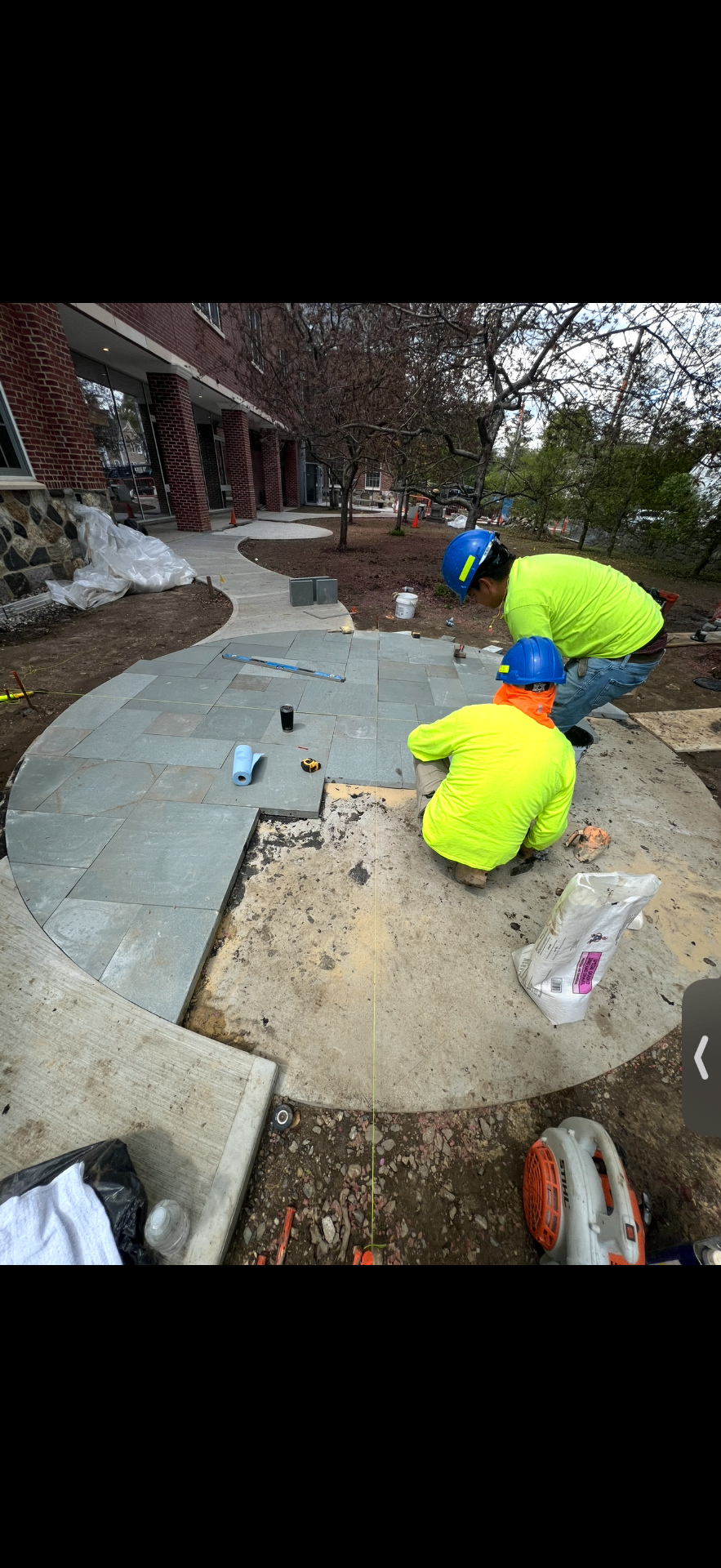 Circular bluestone courtyard laid by masons