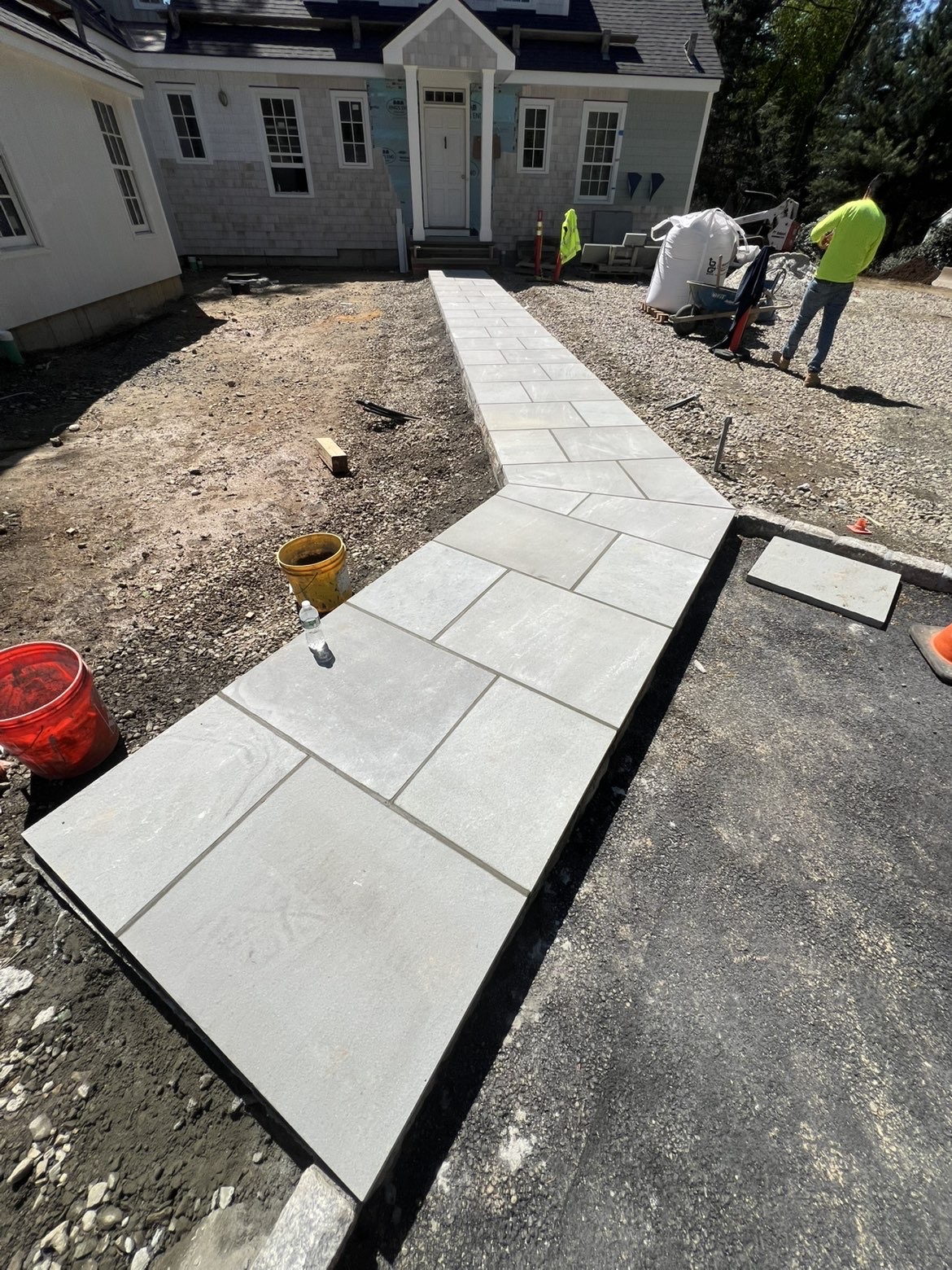 Bluestone front entry walkway leading to a new home